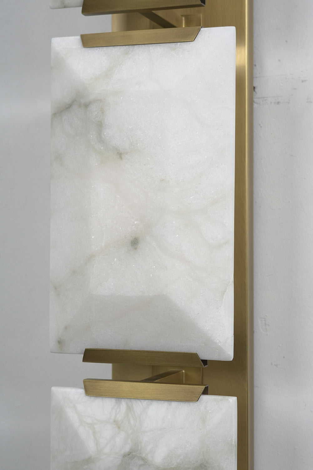 Detailed close-up of faceted alabaster stone panels | Alabaster | Showing the natural grain and geometric surface | Samu Lamp