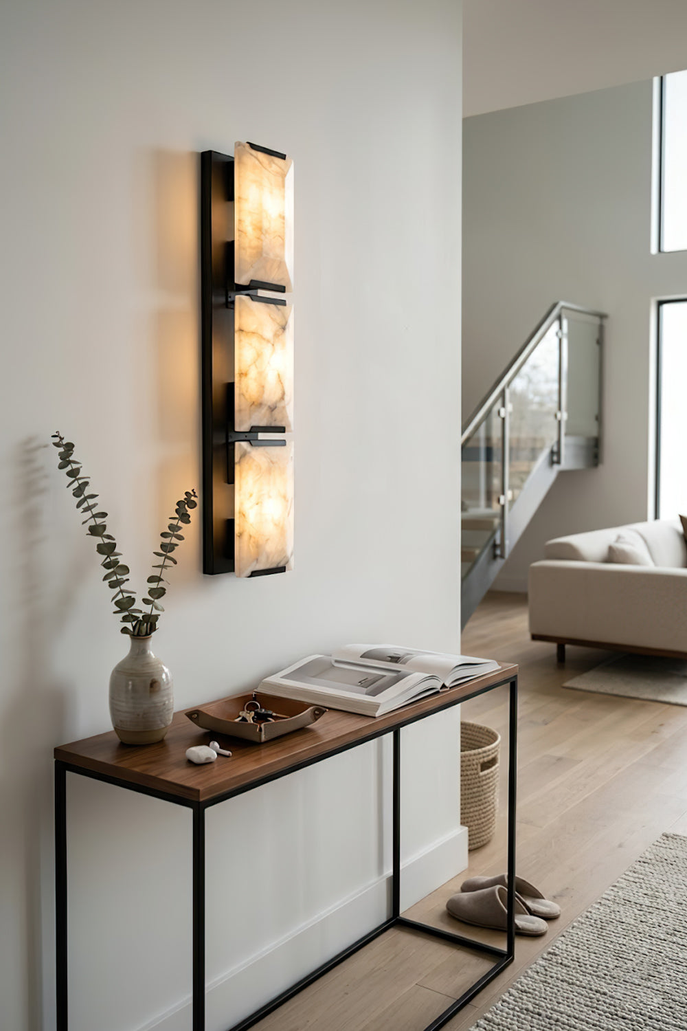 Vertical rectangular alabaster sconce | Brass, Alabaster | Installed in a modern hallway over a console table | Samu Lamp