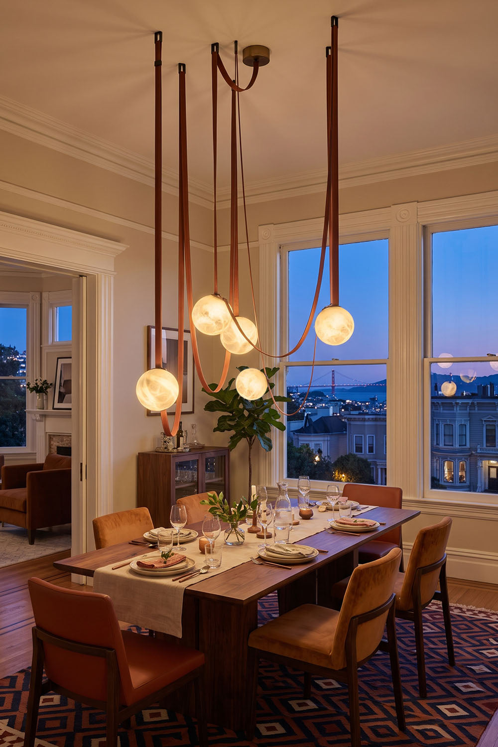 Albiane Draped Chandelier | Alabaster and Woven Rope | Hung above dining table facing scenic city dusk windows | Samu Lamp