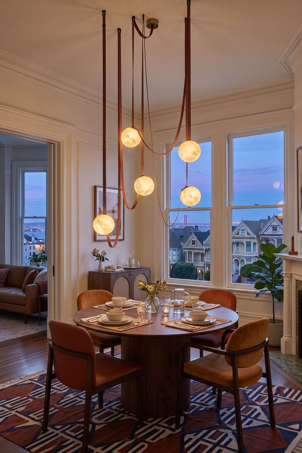 Albiane Draped Chandelier | Alabaster and Woven Rope | Suspended over round wooden dining table by windows | Samu Lamp