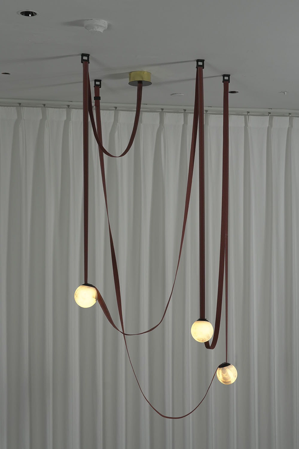 Albiane Draped Chandelier | Alabaster and Woven Rope | Multi-light draped installation lit against white drape | Samu Lamp