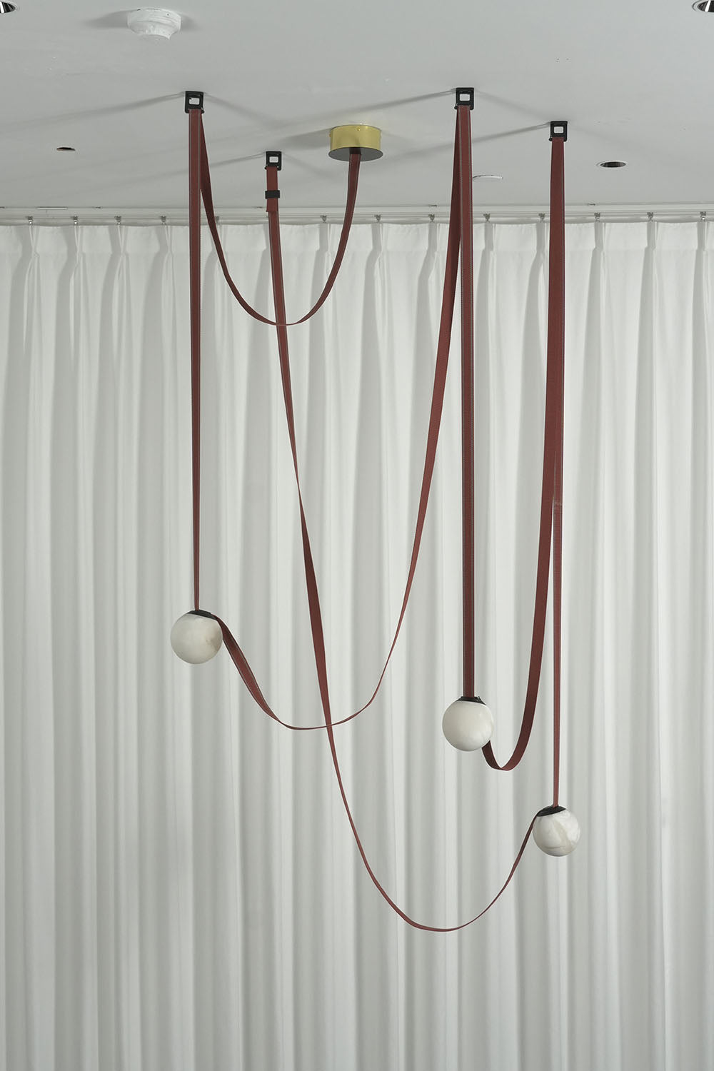 Albiane Draped Chandelier | Alabaster and Woven Rope | Side angle of multi-globe canopy lit in studio space | Samu Lamp