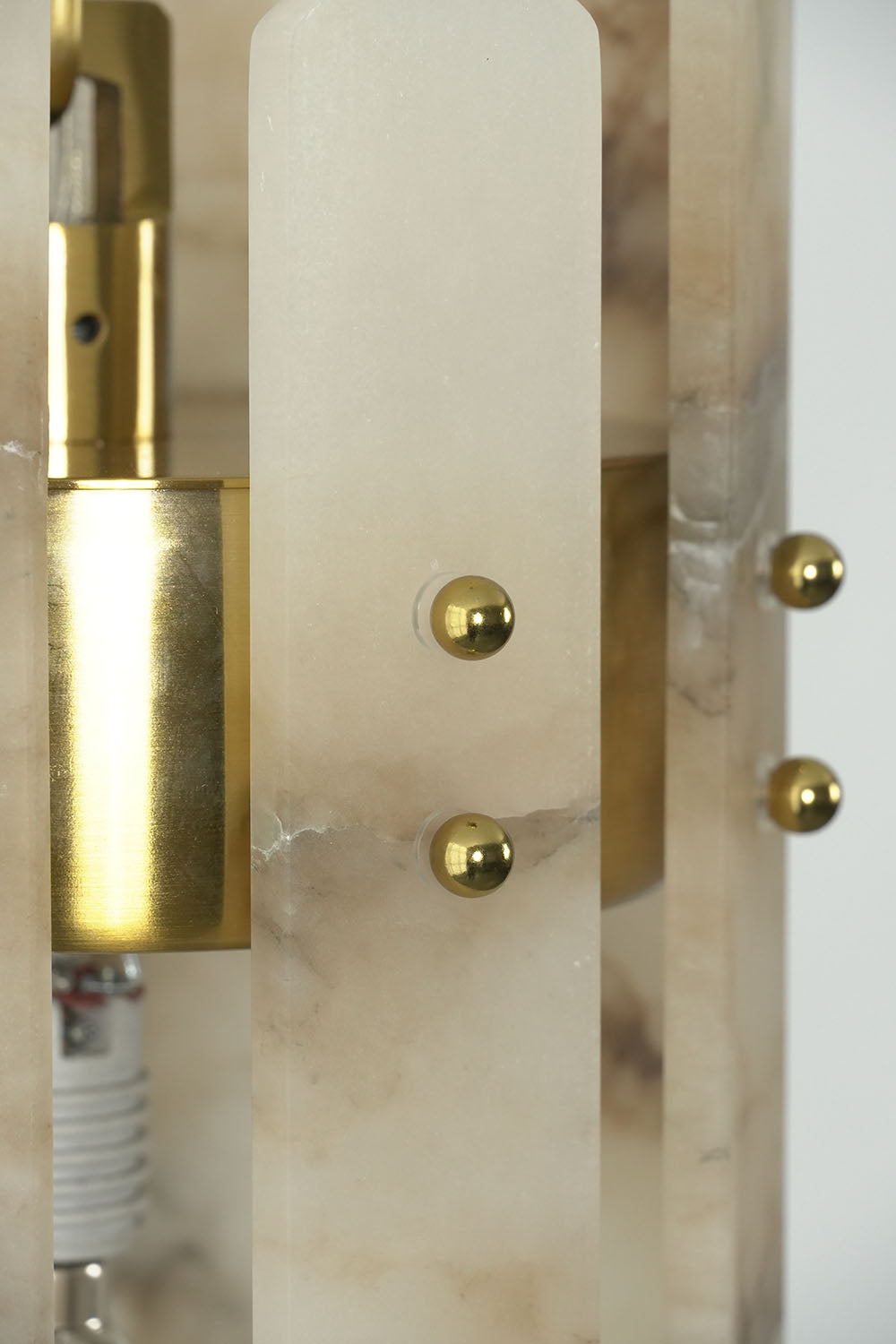 Albrenne Alabaster Mini Pendant | Solid Brass and Alabaster | Close-up of brass hardware screws and socket holder | Samu Lamp
