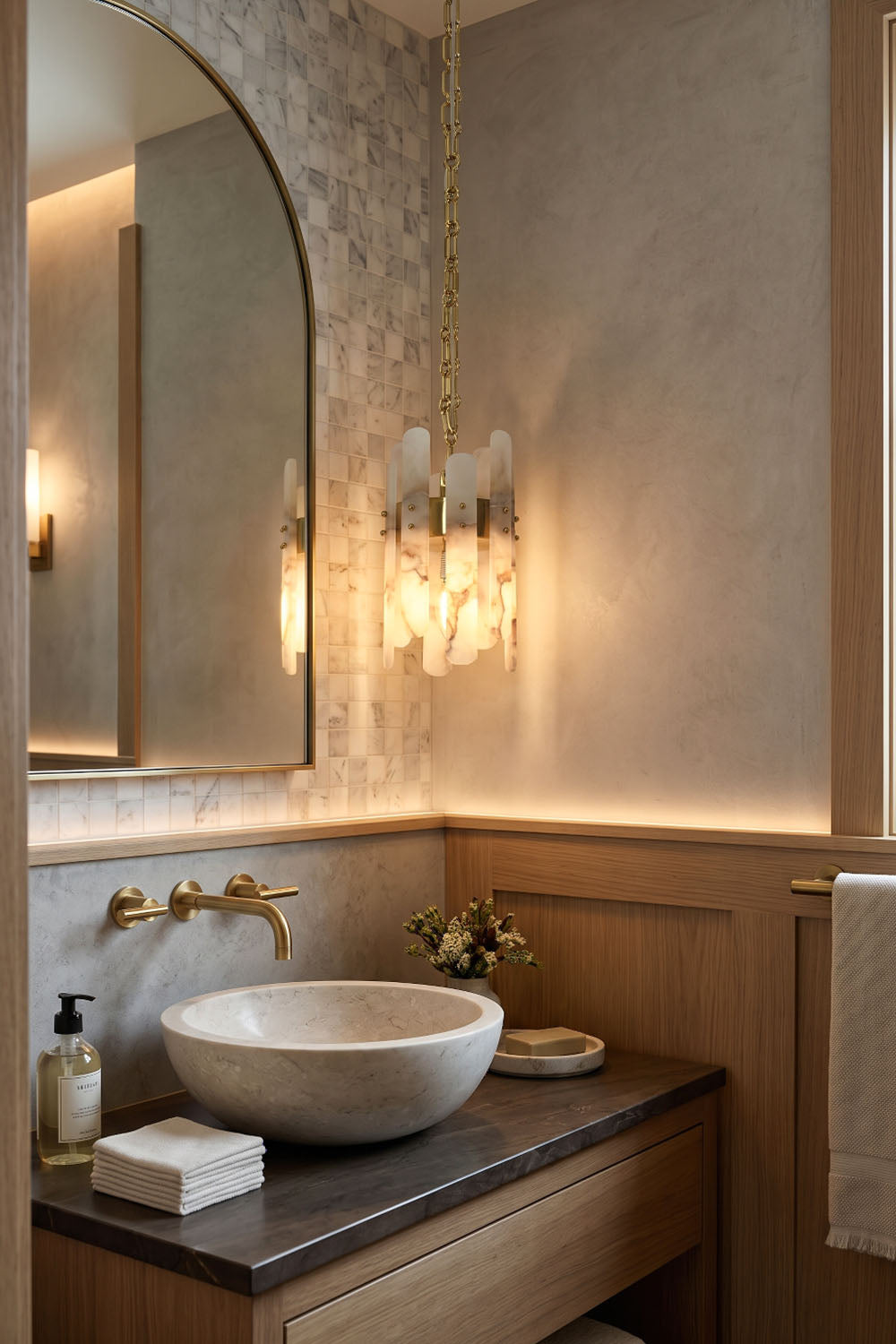 Albrenne Alabaster Mini Pendant | Natural Stone and Brass | Installed beside round mirror in luxury powder room | Samu Lamp