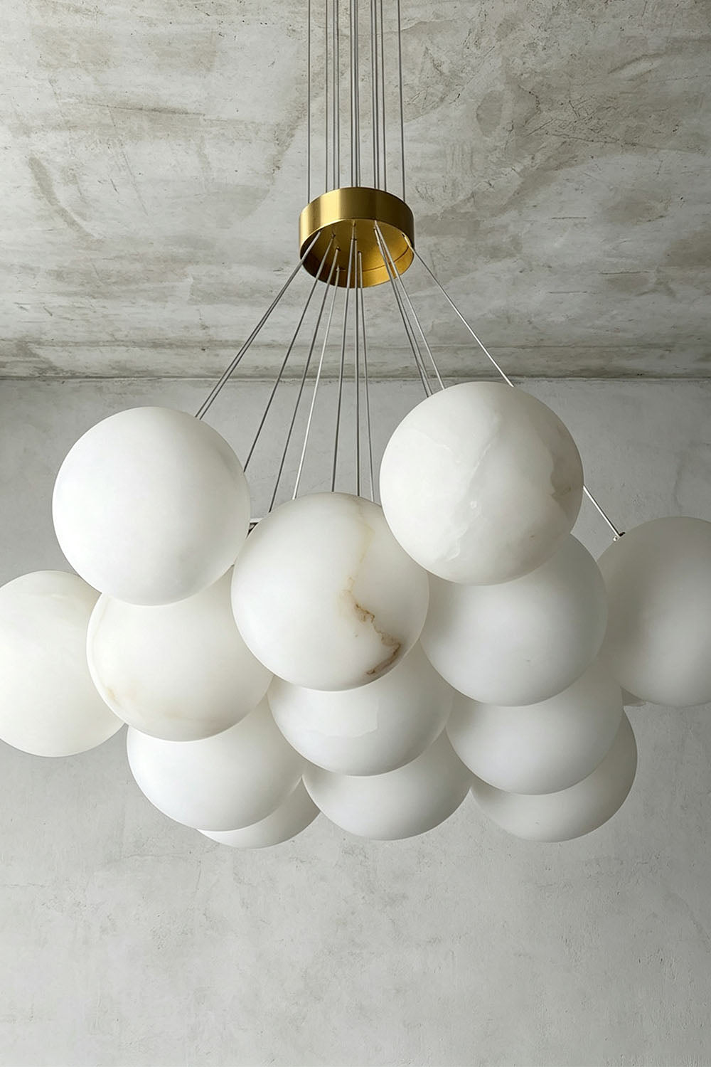 Amandine Alabaster Globe Cluster Pendant Light with elegant clustered design and gold accents.