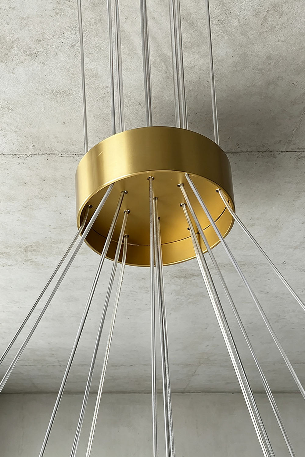 Amandine Alabaster Globe Cluster Pendant Light close-up of gold fixture base and cables.