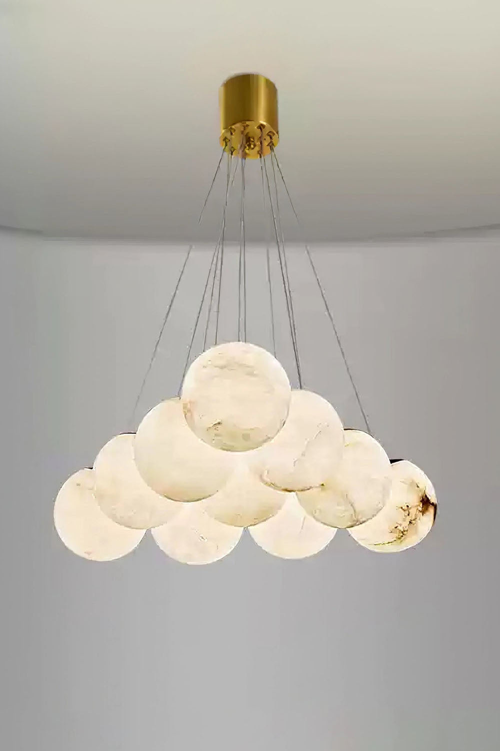 Amandine Alabaster Globe Cluster Pendant Light showcasing a clustered design with alabaster globe elements.