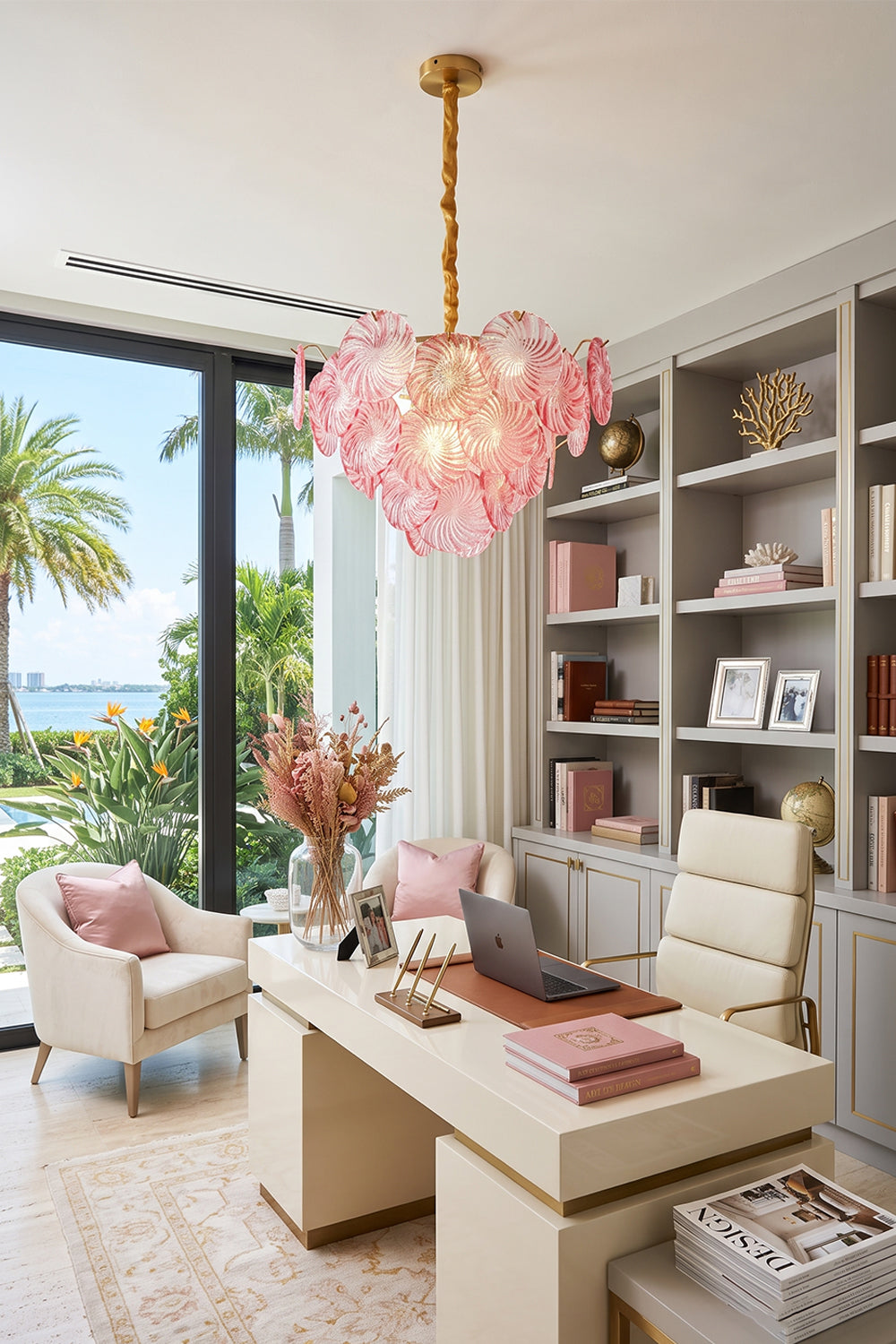 Amara Pink Glass Petal Chandelier | Luxury Home Office | The elegant pink glass variant illuminating a chic contemporary study room next to a soft cream desk and pink chair | Samu Lamp