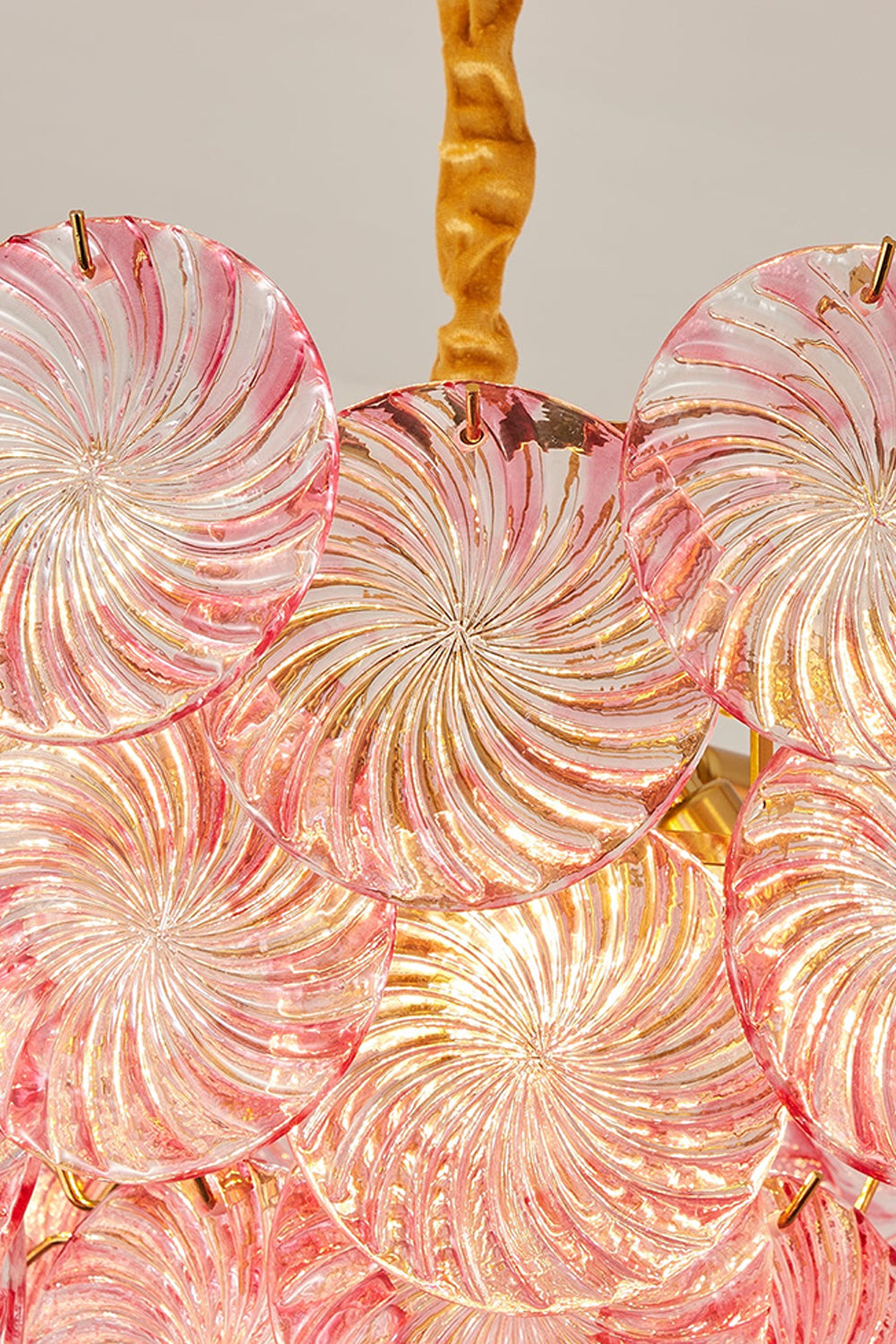 Amara Pink Glass Petal Chandelier | Illuminated Glass | Detailed macro shot of the pink Murano-style glass petals glowing warmly under internal illumination | Detail shot | Samu Lamp