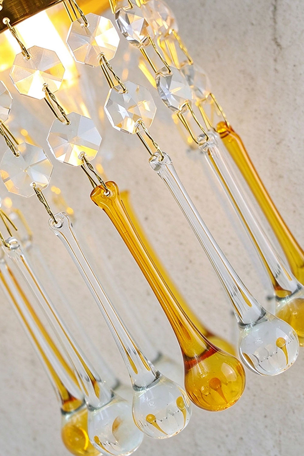 Ambrelise Cherub Wall Sconce | Cut Crystal and Brass | Macro view of faceted crystal prisms and amber rods | Samu Lamp