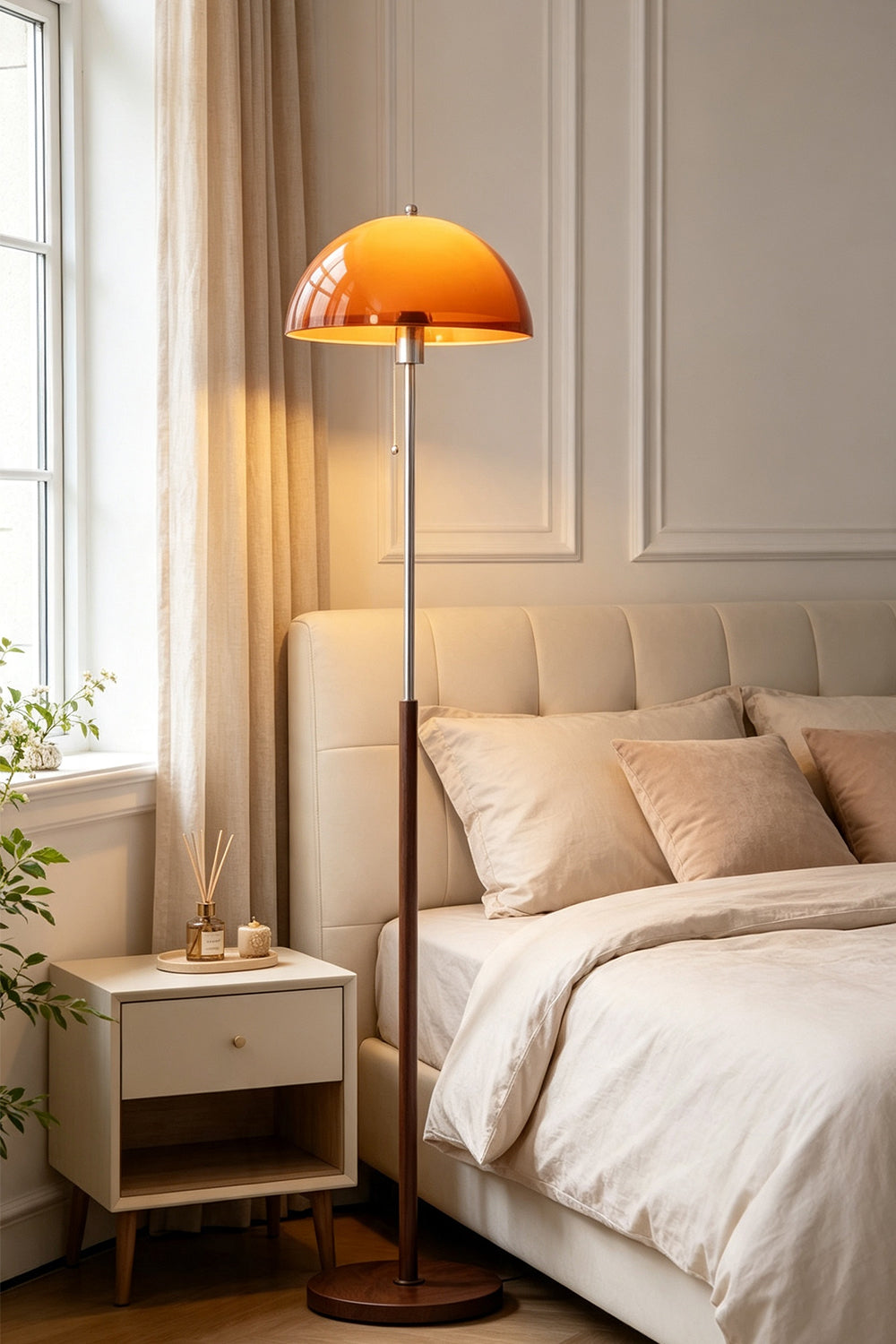 Ambrose Amber Dome Floor Lamp | Amber Glass, Metal and Wood | Standing beside a bed in a cozy bedroom setting | Samu Lamp