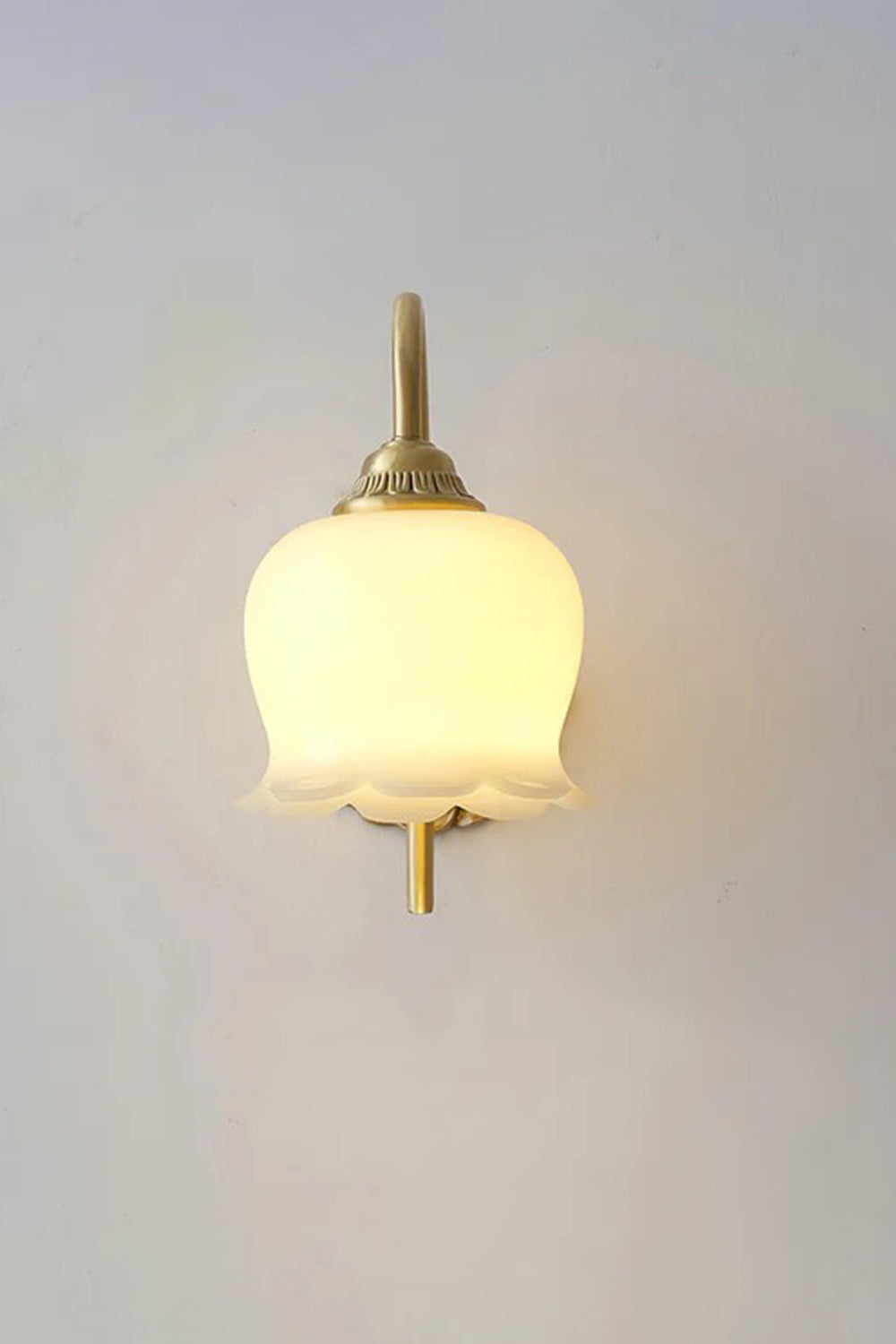 Amelie Vintage Tulip Wall Lamp with frosted glass shade and antique brass details.