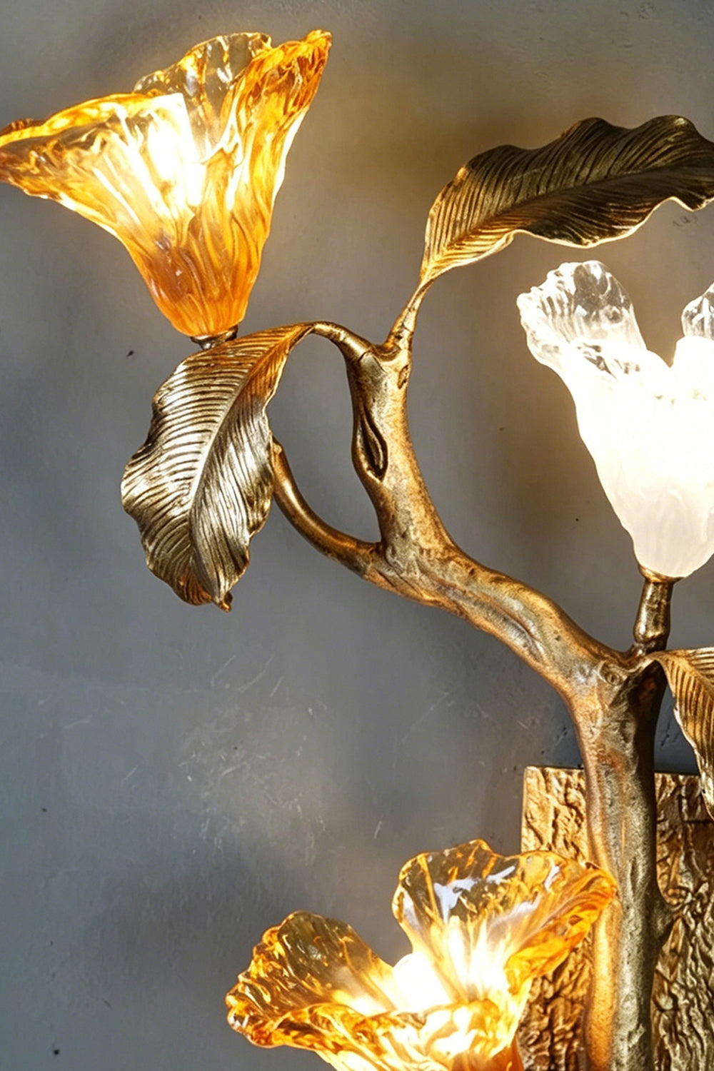 Arboreal Bloom Brass Wall Lamp | Brass, Glass | Close-up of the glowing textured glass flower-like shades | Detail shot | Samu Lamp
