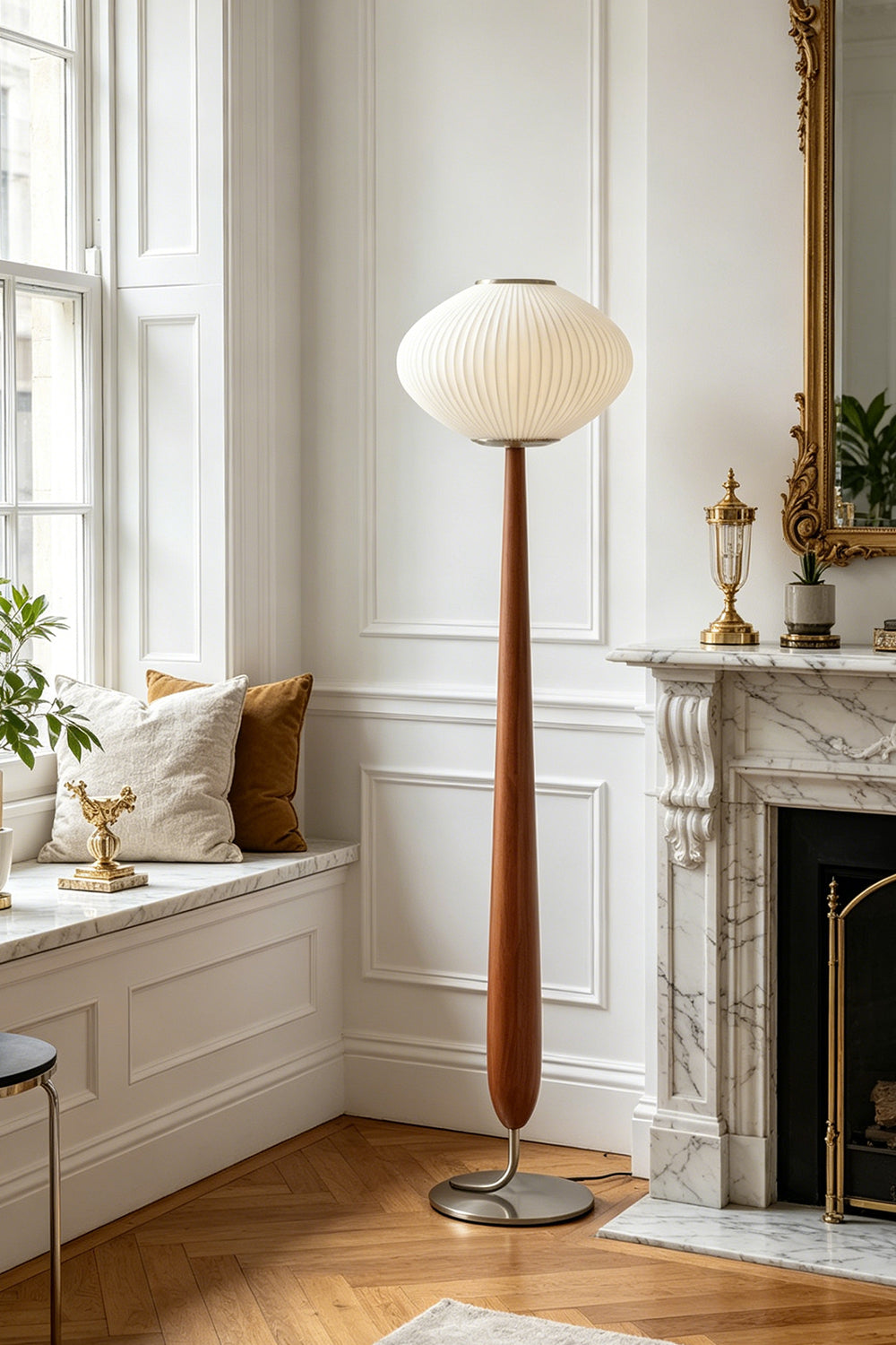 Arden Walnut Floor Lamp | Wood, Metal, Fabric | Positioned beautifully in a traditional living room corner featuring white windows, a classic mantle piece, and herringbone hardwood floors | Samu Lamp
