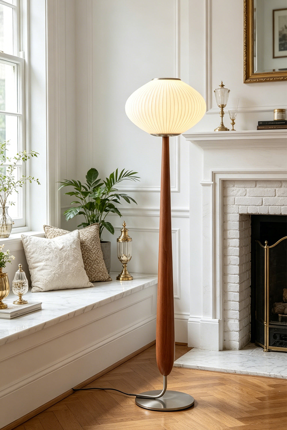 Arden Walnut Floor Lamp | Wood, Metal, Fabric | Placed elegantly next to a built-in white window bench seat in a sunlit classical lounge room with a fireplace | Samu Lamp