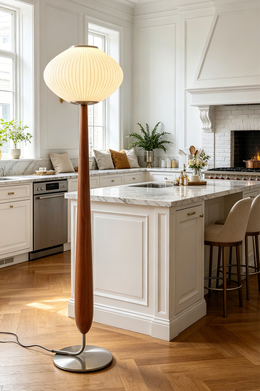 Arden Walnut Floor Lamp | Wood, Metal, Fabric | Staged as a stylish overhead light fixture in a modern open kitchen next to a classic white island counter with wood flooring | Samu Lamp