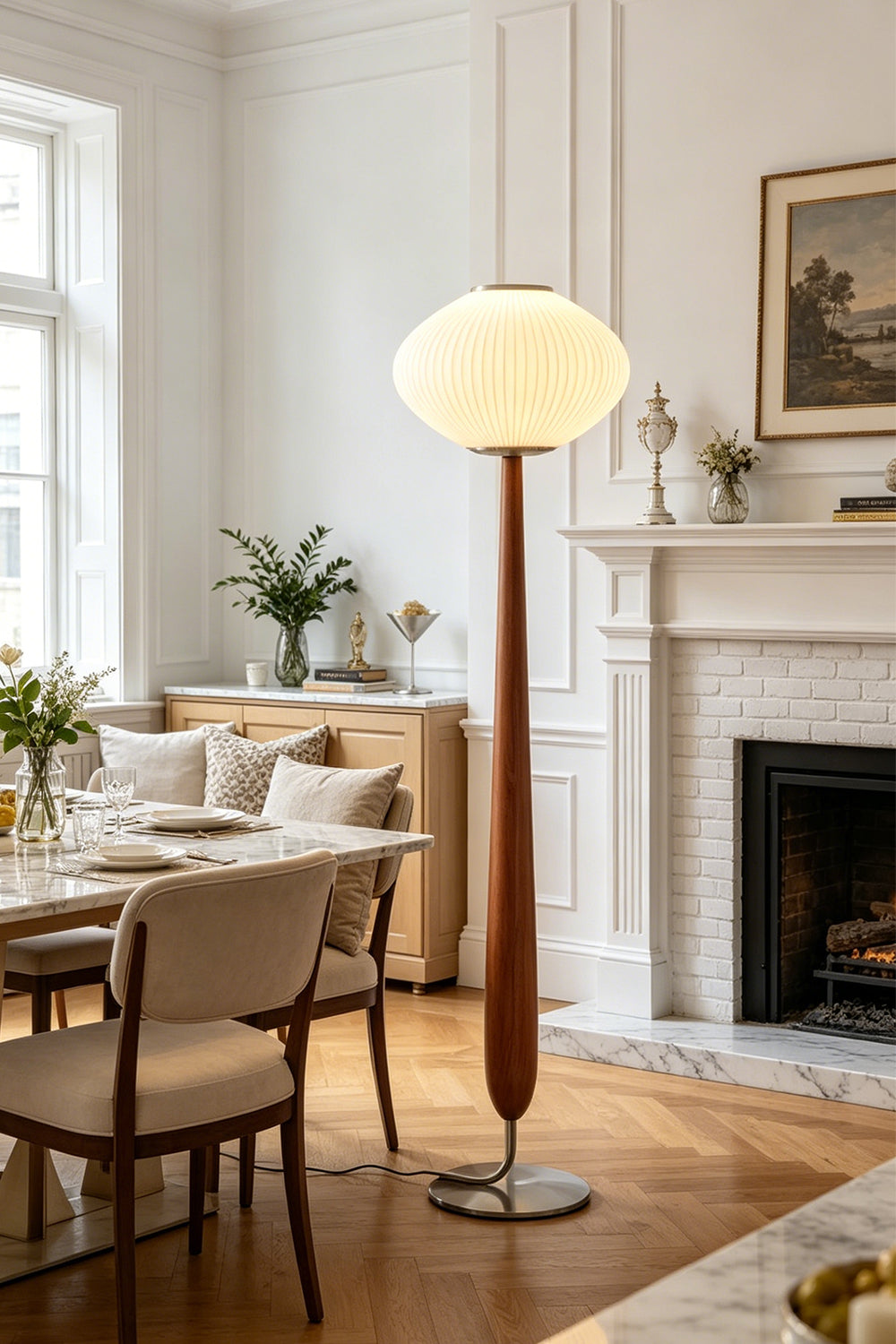 Arden Walnut Floor Lamp | Wood, Metal, Fabric | Standing as a warm accent light in a bright classical dining and living room corner near a fireplace and dining table setup | Samu Lamp