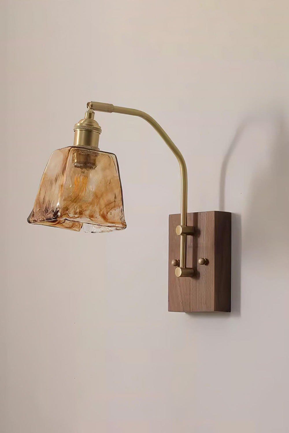 Arlo Amber Ripple Wall Lamp | Glass, Metal, Wood | Full view of the hanging glass fixture showcasing the clean integration of wood, brass, and rippled amber glass | Samu Lamp