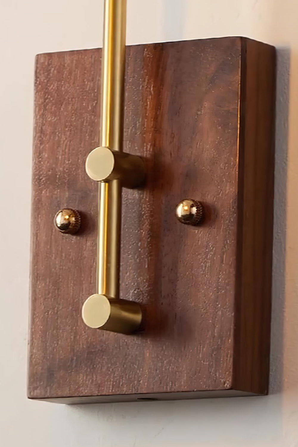 Arlo Amber Ripple Wall Lamp | Glass, Metal, Wood | Macro close-up view highlighting the rich texture of the rectangular dark wood wall mount plate and brass fittings | Detail shot | Samu Lamp