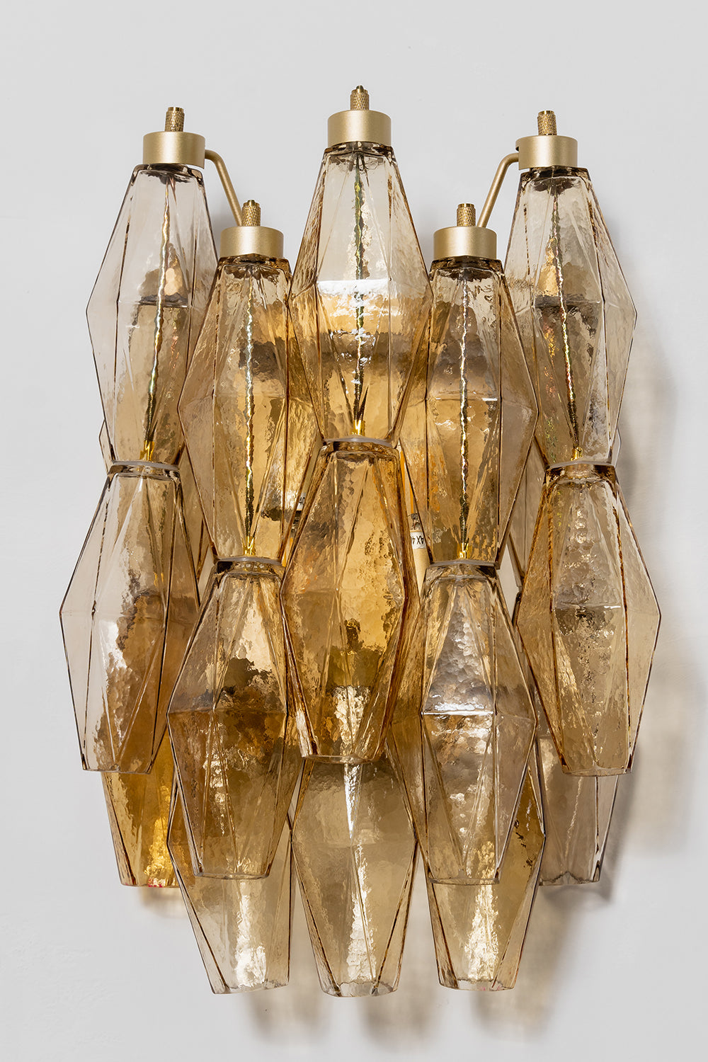 Unlit amber Art Poliedri wall sconce | Metal, Glass | Front perspective showing the layered glass prisms | Samu Lamp