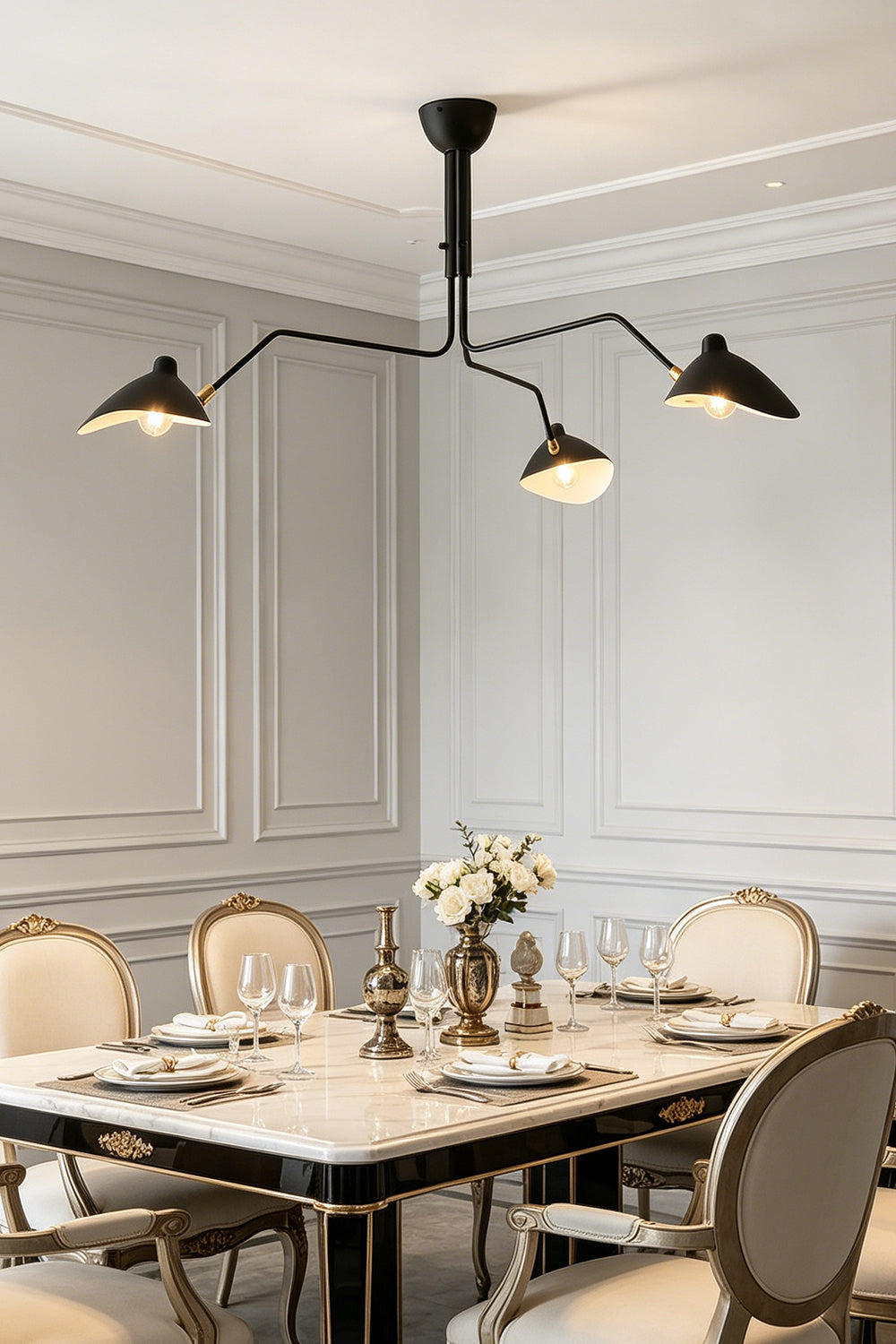 Black 3-arm articulated multi arm spider light | Metal | Installed in a formal dining room with upholstered chairs | Samu Lamp