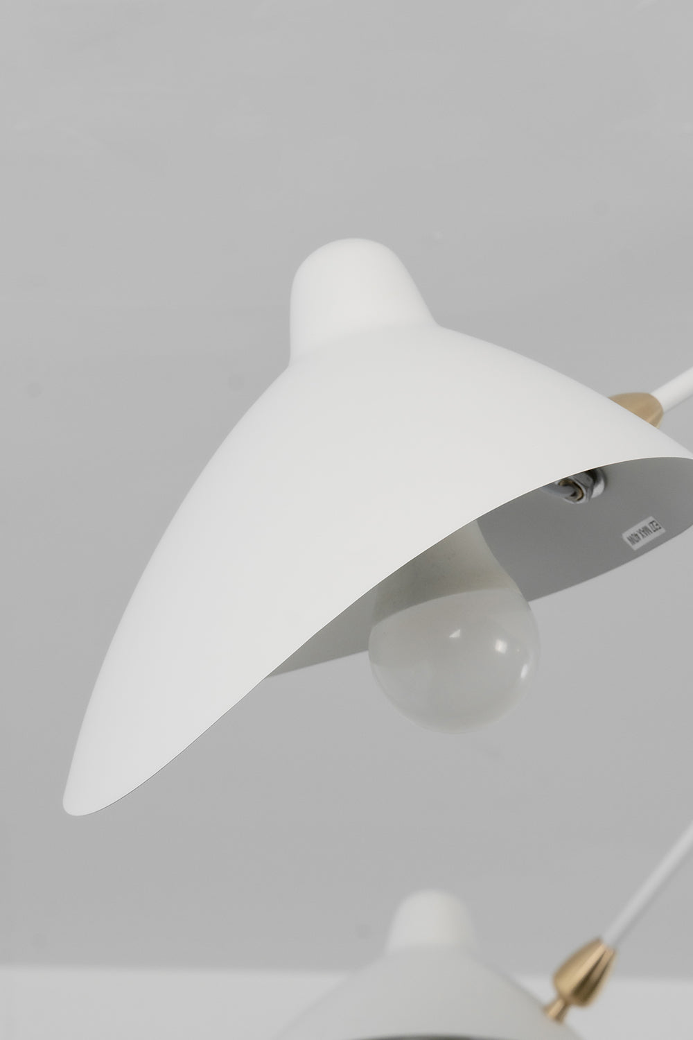 White dome shade profile on spider light | Metal | Close-up showing the sleek curved metal design | Samu Lamp