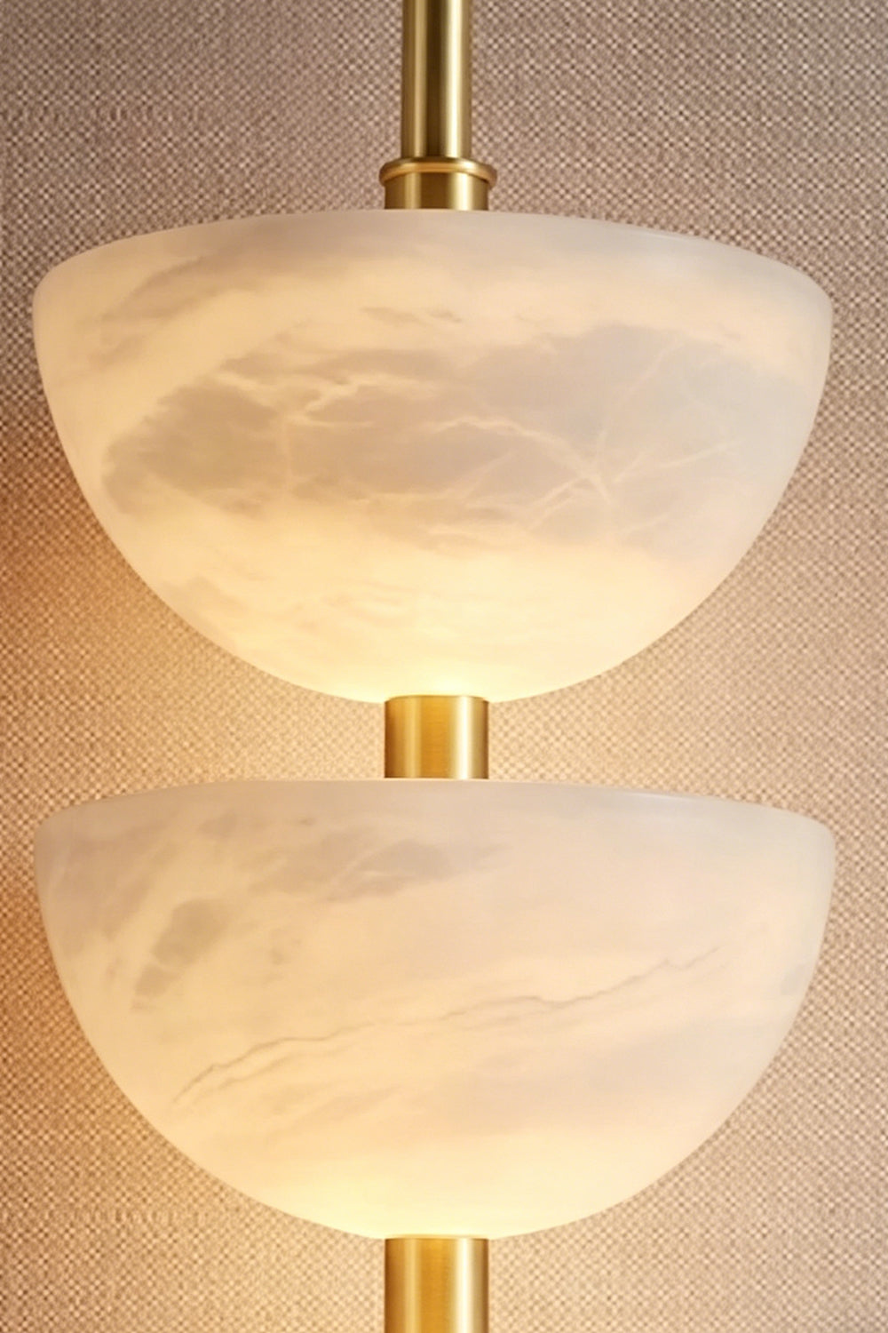 Ascendant Wall Lamp bowl detail | Alabaster | Close-up of lit stone texture and warm glow | Samu Lamp