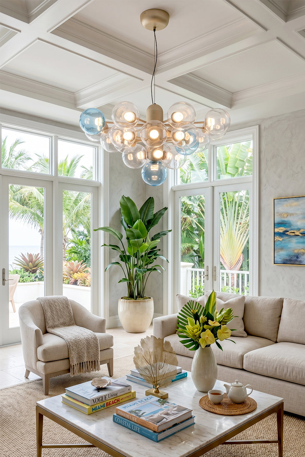 Astraea Prismatic Globe Chandelier | Glass, Metal | Styled beautifully in a spacious bright open-concept living space with a white paneled ceiling and neutral furniture layouts | Samu Lamp