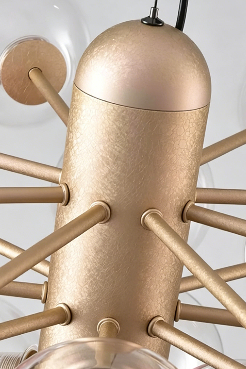 Astraea Prismatic Globe Chandelier | Glass, Metal | Macro close-up view focusing on the brushed matte texture of the champagne gold metallic core cylinder and frame spokes | Detail shot | Samu Lamp