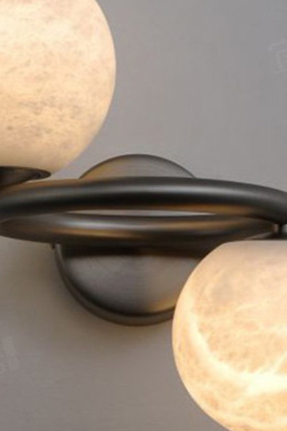 Aura Two-Globe Alabaster Wall Sconce showcasing translucent alabaster globes with a sculptural metal arm.
