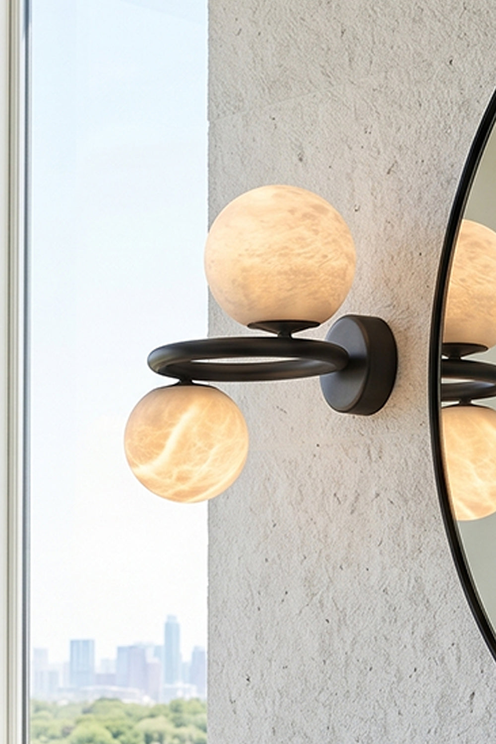 Aura Two-Globe Alabaster Wall Sconce showcasing two alabaster globes on a curved metal arm.