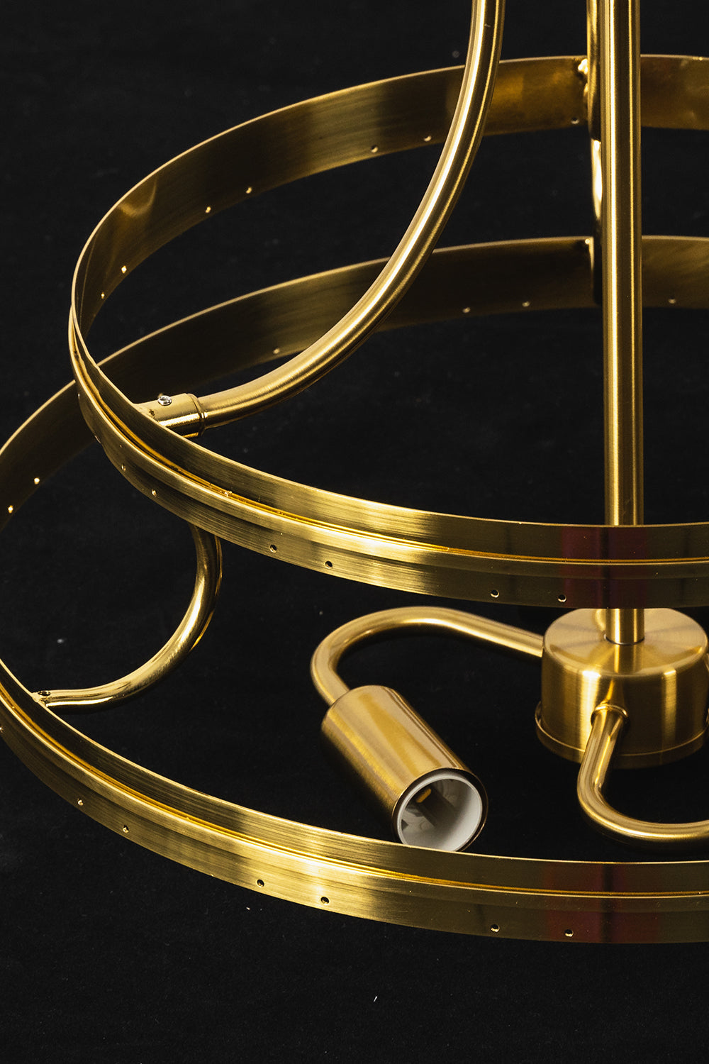 Aura Verdant Tiered Green Glass Ceiling Light | Metal, Glass | Detailed view of the unlit gold frame ring and internal bulb sockets against a dark background | Detail shot | Samu Lamp