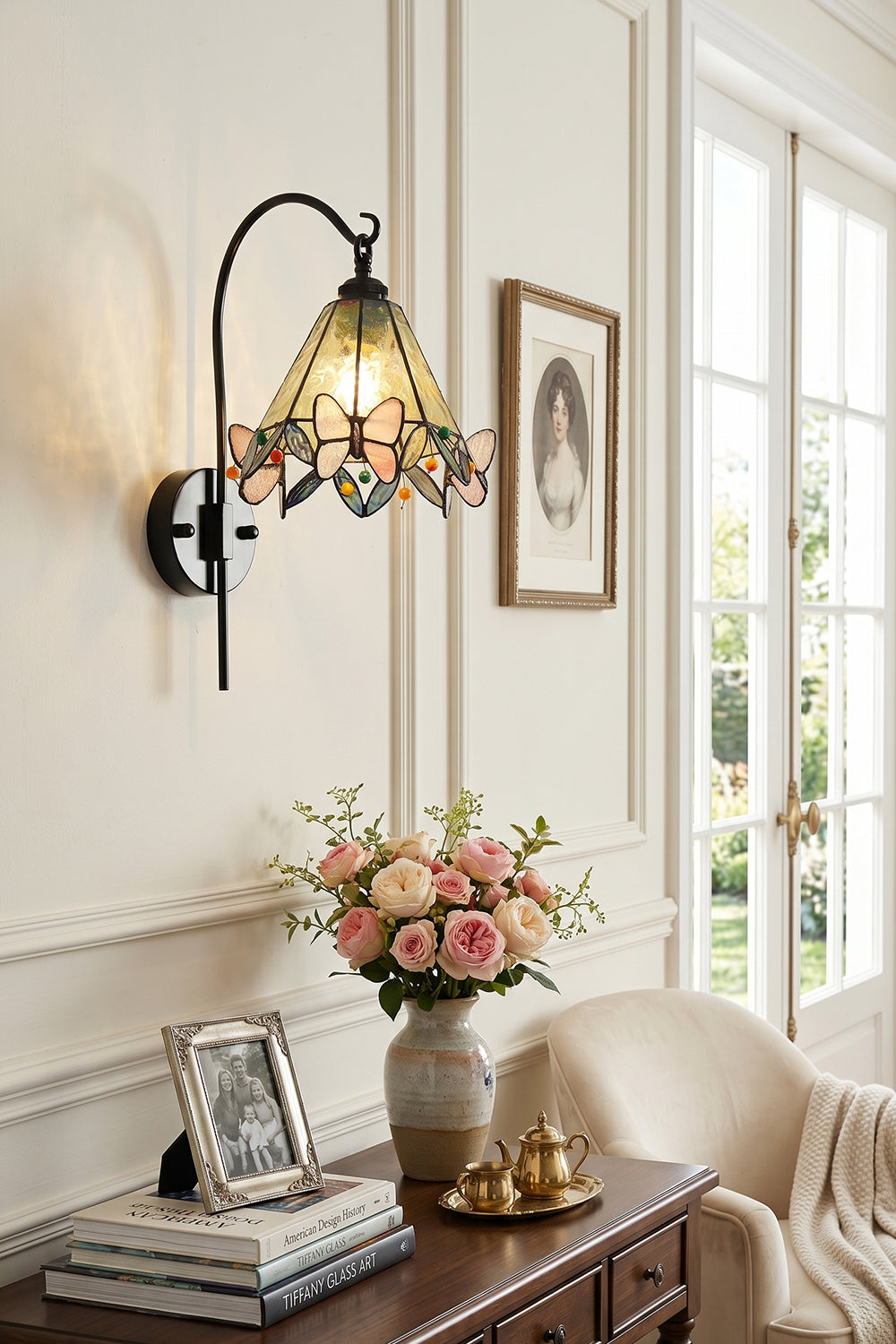 Aura Vine Stained Glass Wall Sconce | Glass, Metal | Mounted on a paneled wall above a vintage wooden cabinet with a glass vase holding pink flowers | Samu Lamp
