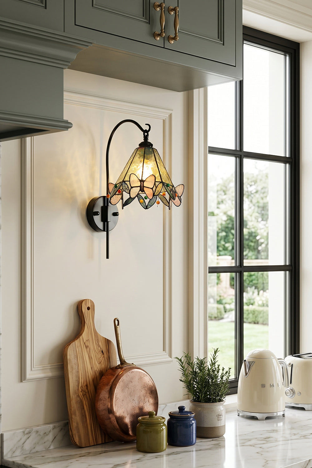 Aura Vine Stained Glass Wall Sconce | Glass, Metal | Mounted on a white wall in a cozy farmhouse kitchen next to a window over a countertop with rustic accessories | Samu Lamp