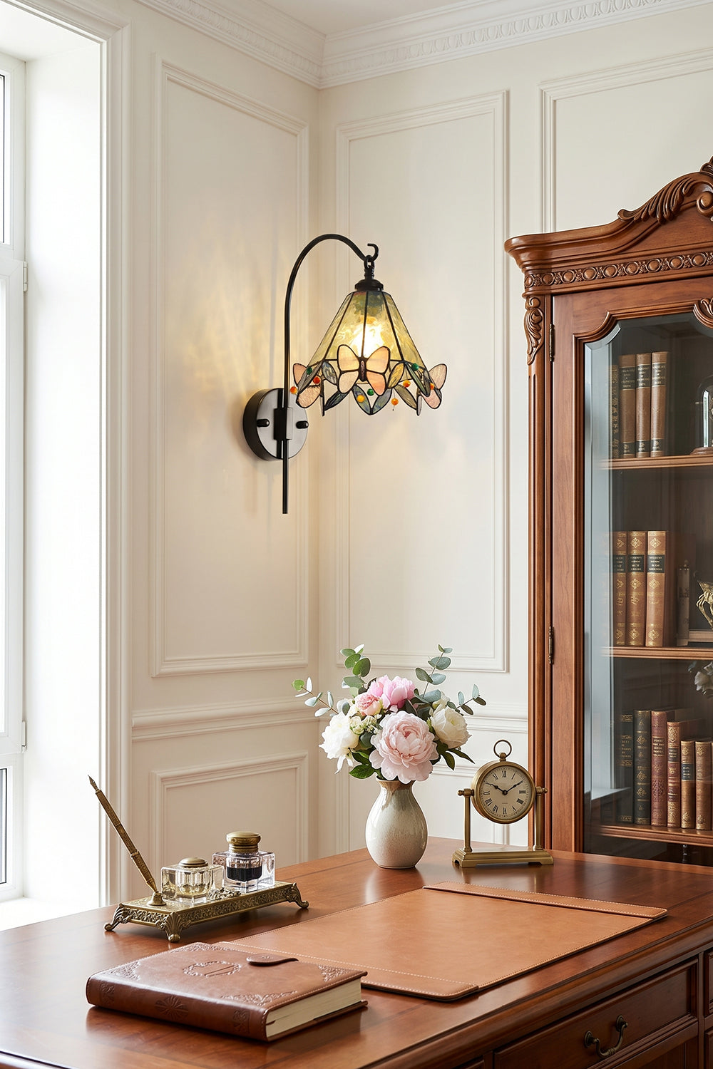 Aura Vine Stained Glass Wall Sconce | Glass, Metal | Wall-mounted next to a large window in a classic study room, illuminating a vintage wooden executive desk | Samu Lamp