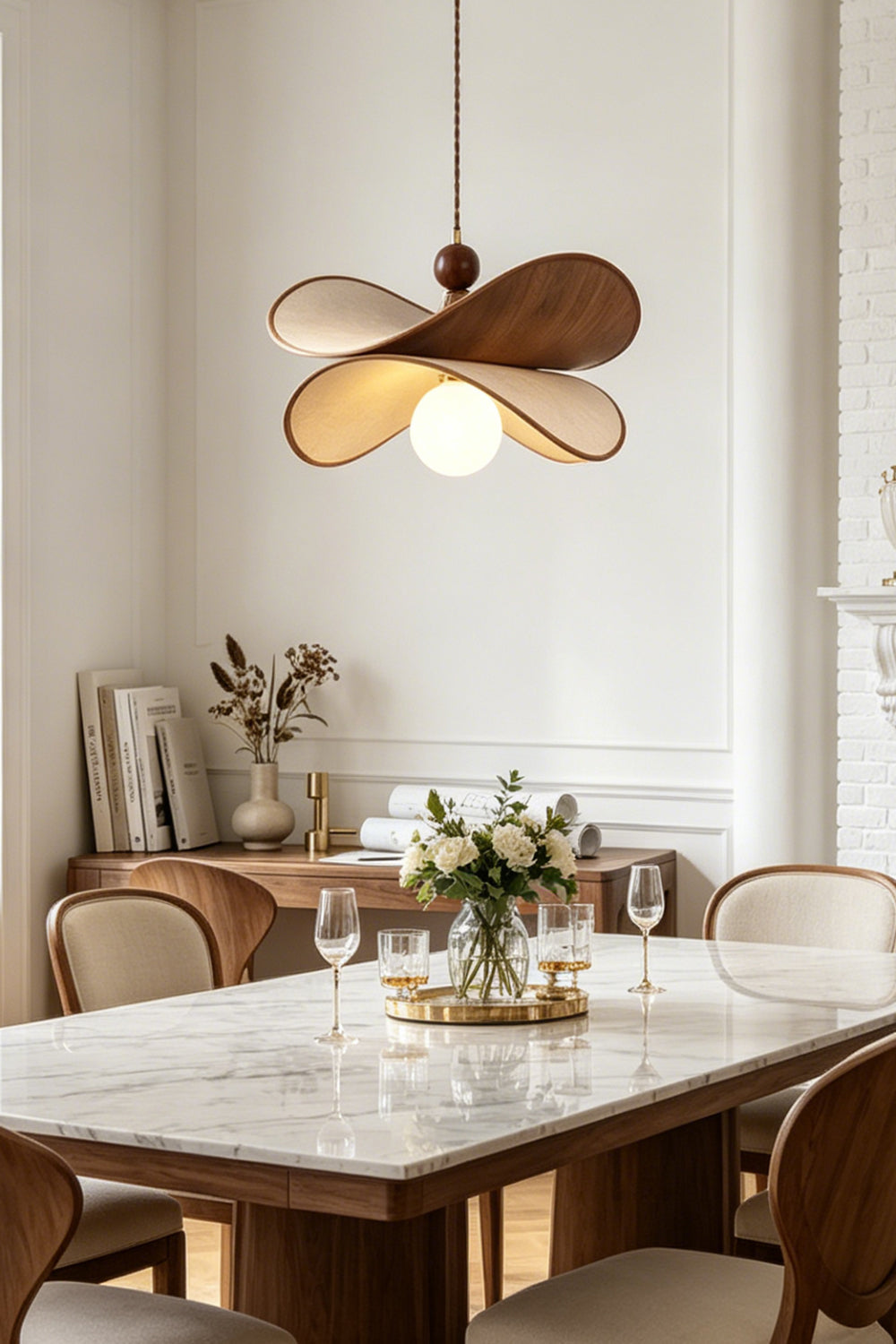 Aurelia Blossom Glass Pendant Light | Wood, Fabric, Glass | Providing warm ambient downlight over a contemporary white marble dining table paired with minimalist wooden chairs | Samu Lamp