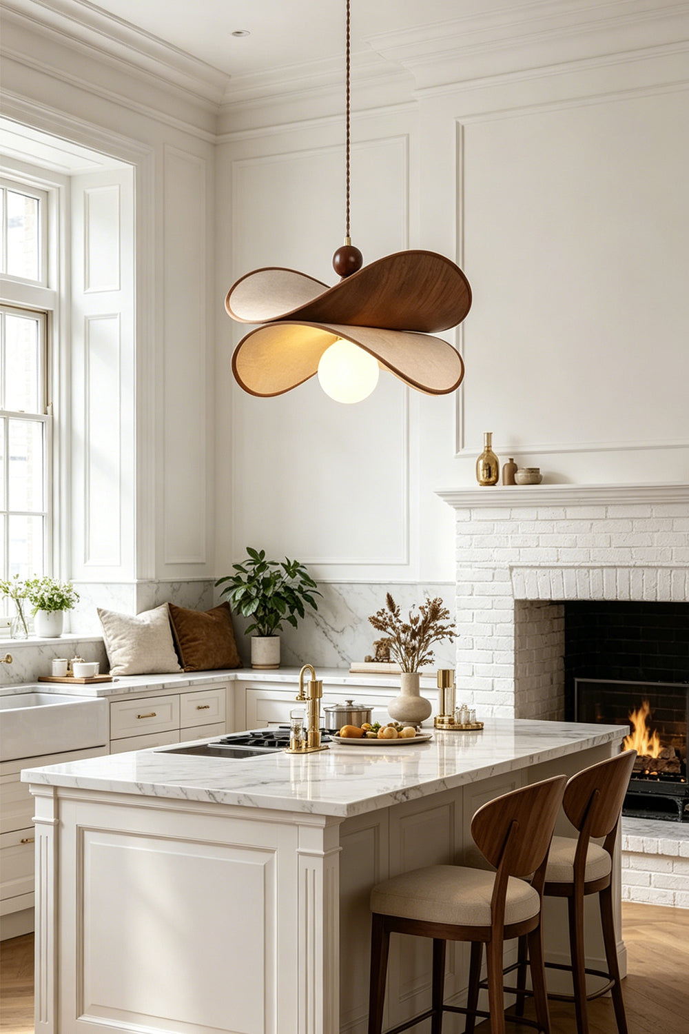 Aurelia Blossom Glass Pendant Light | Wood, Fabric, Glass | Suspended elegantly above a pristine white kitchen island counter with matching bar stools near a burning fireplace | Samu Lamp