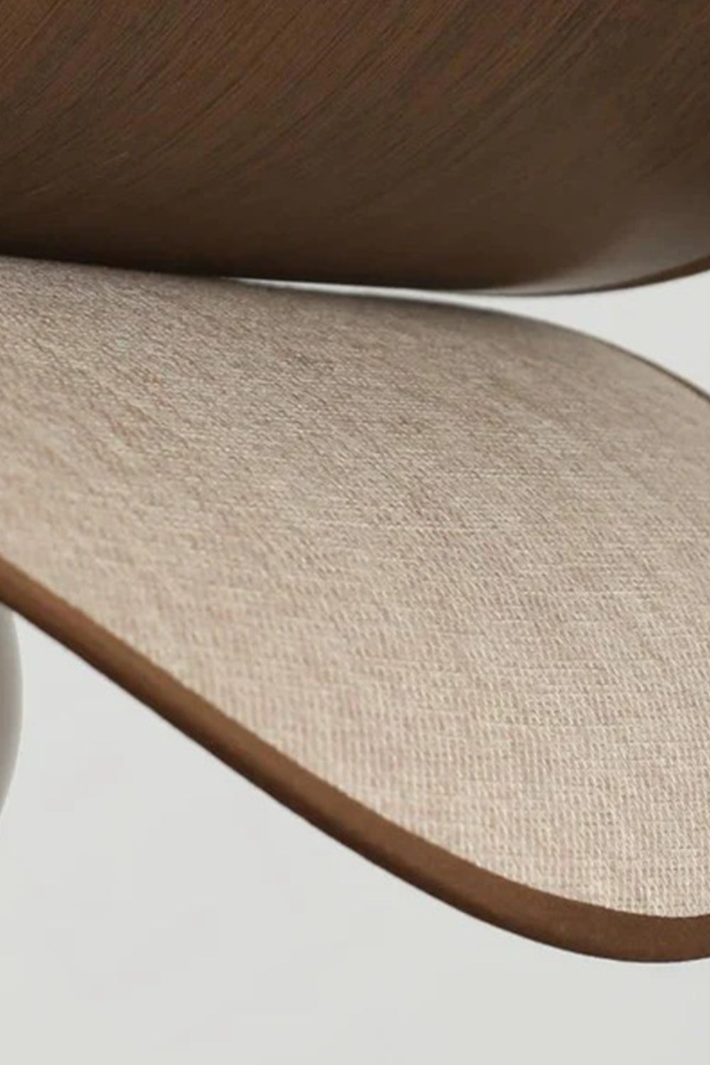 vAurelia Blossom Glass Pendant Light | Wood, Fabric, Glass | Macro close-up focus on the curved edge texture highlighting the contrast between smooth walnut wood veneer and woven linen fabric layers | Detail shot | Samu Lamp