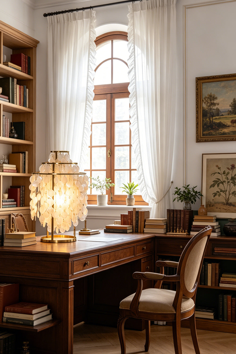 Aurelia Tiered Capiz Table Lamp | Capiz Shell, Metal | Alternative view of the traditional home office layout with the glowing shell lamp as a desk centerpiece | Samu Lamp