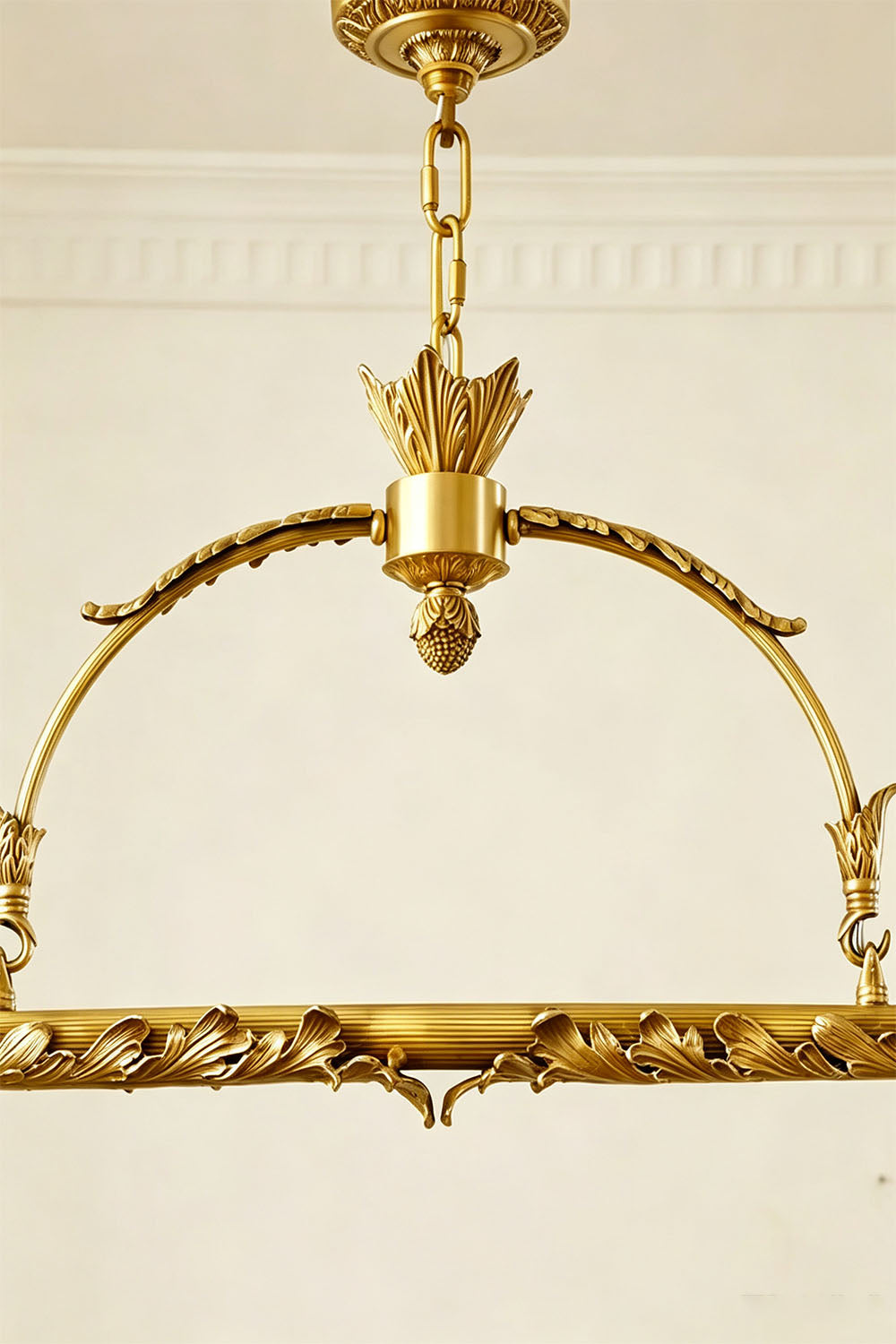 Aurelien Crystal Crown Brass Island Chandelier | Cut Crystal and Brass | Close-up view of the arched brass frame and decorative hardware | Samu Lamp