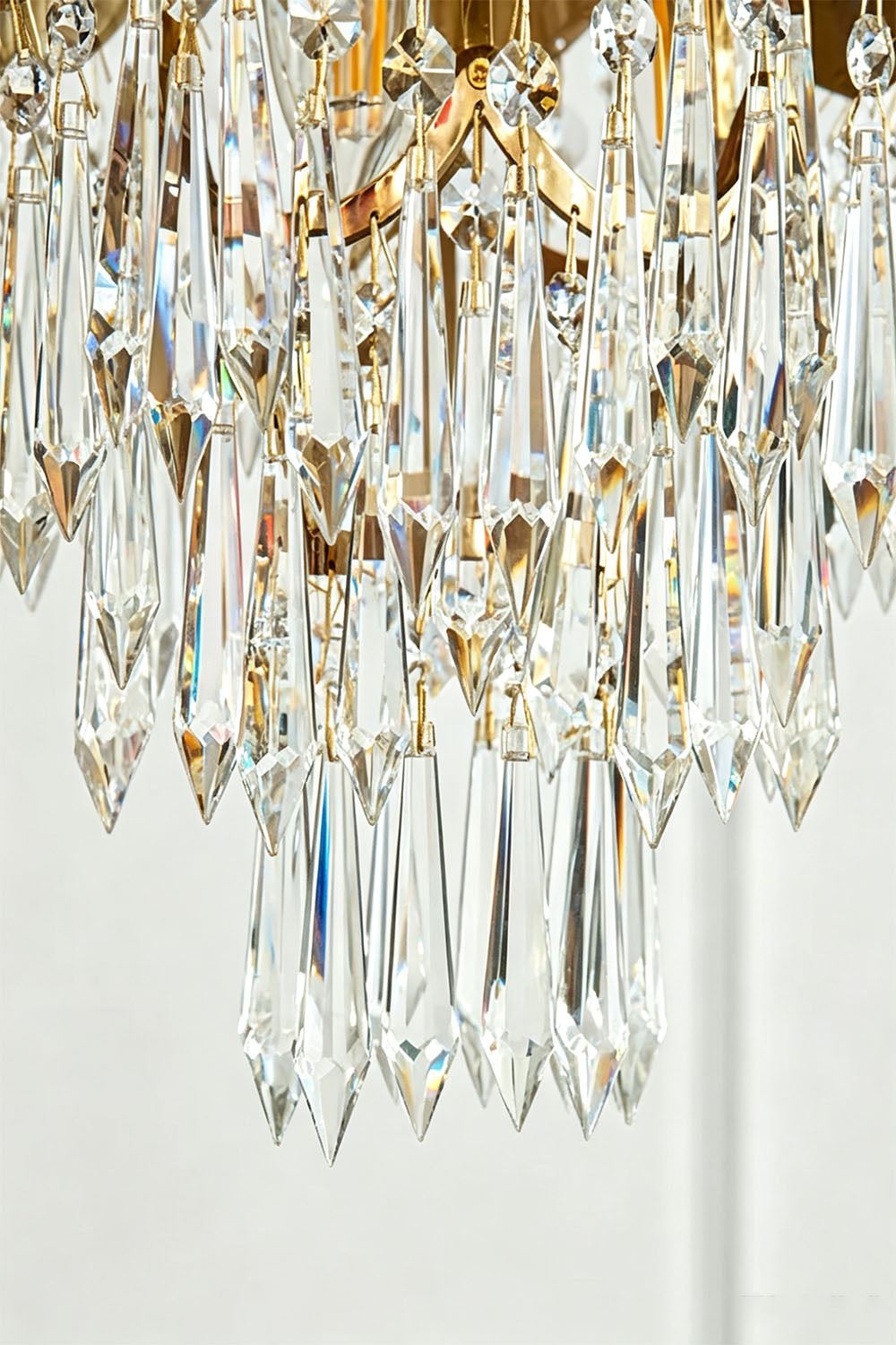 Aurelien Crystal Crown Brass Island Chandelier | Cut Crystal and Brass | Macro detail shot of the sparkling faceted clear crystal droplets | Samu Lamp