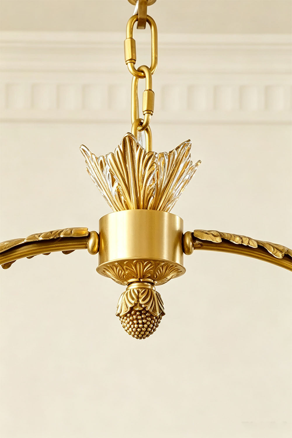 Aurelien Crystal Crown Brass Island Chandelier | Cut Crystal and Brass | Detail shot of the top brass canopy, hanging chain, and center arch finial | Samu Lamp