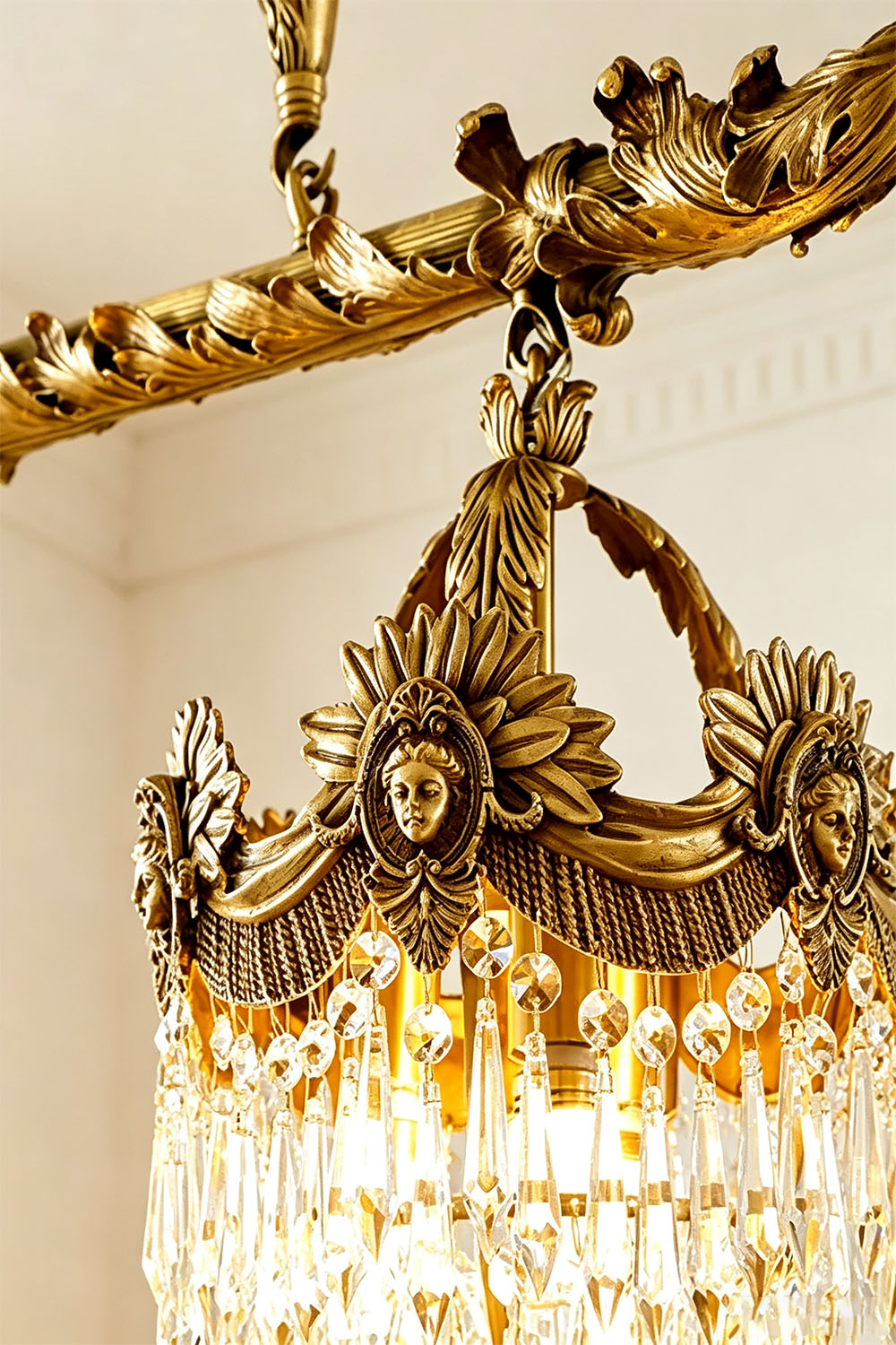 Aurelien Crystal Crown Brass Island Chandelier | Cut Crystal and Brass | Close-up of the carved brass crown ring with clear crystal prism drops | Samu Lamp