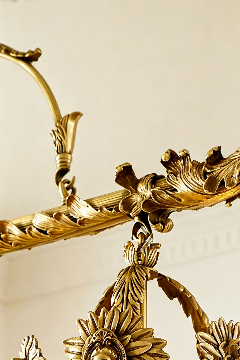 Aurelien Crystal Crown Brass Island Chandelier | Cut Crystal and Brass | Detail perspective highlighting the intricate brass scrollwork and floral accents | Samu Lamp
