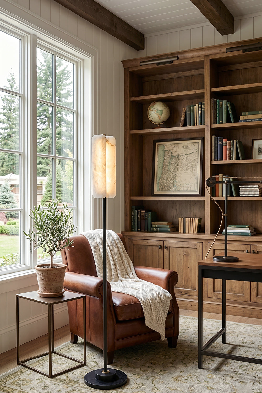 Aurelius Alabaster Brass Floor Lamp | Alabaster, Brass | Standing as an elegant reading light in a traditional study room next to a brown leather armchair and a large wooden bookcase | Samu Lamp