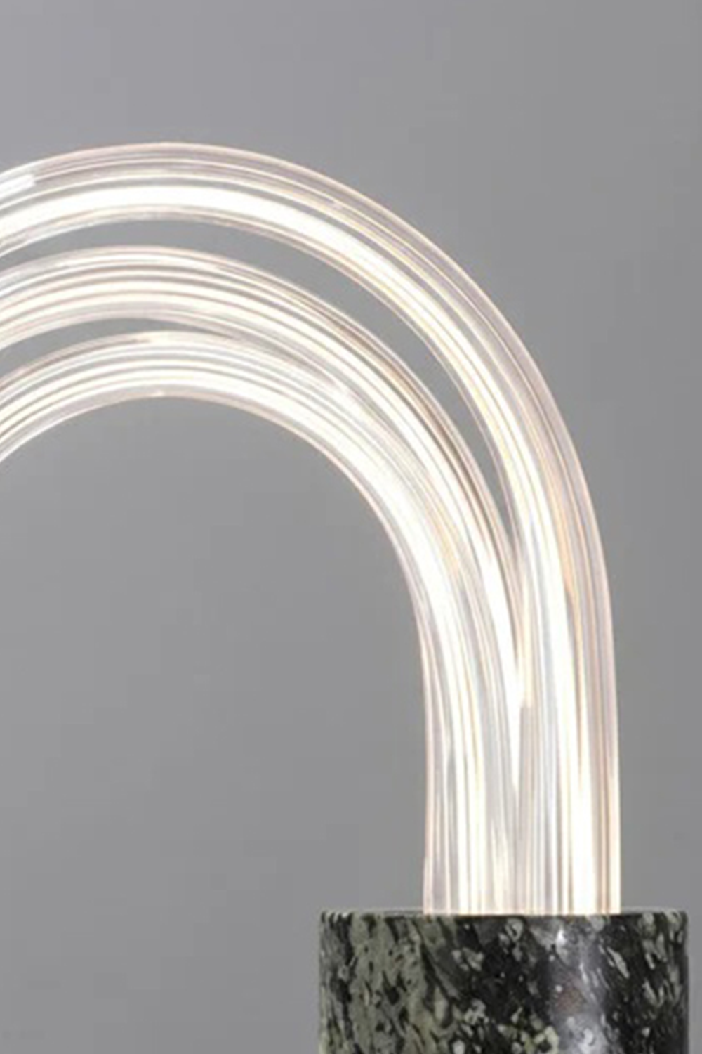 Aurelius Ribbed Marble Table Lamp showcasing its elegant glass shade and ribbed marble base.