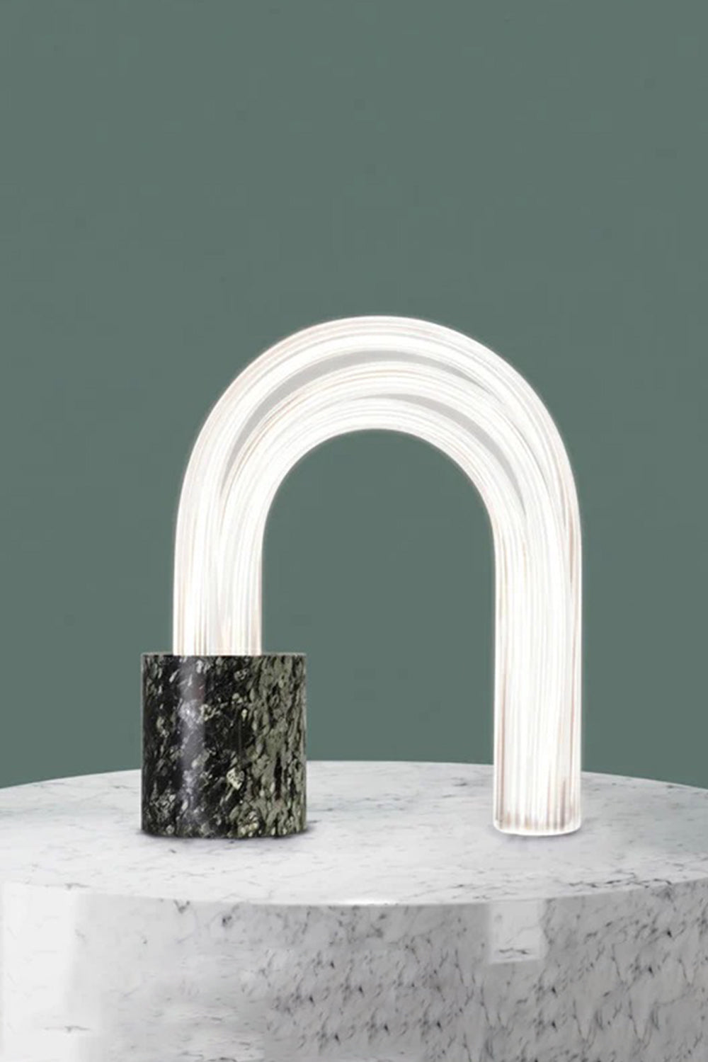 Aurelius Ribbed Marble Table Lamp showcasing architectural design with ribbed glass shade and solid marble base.