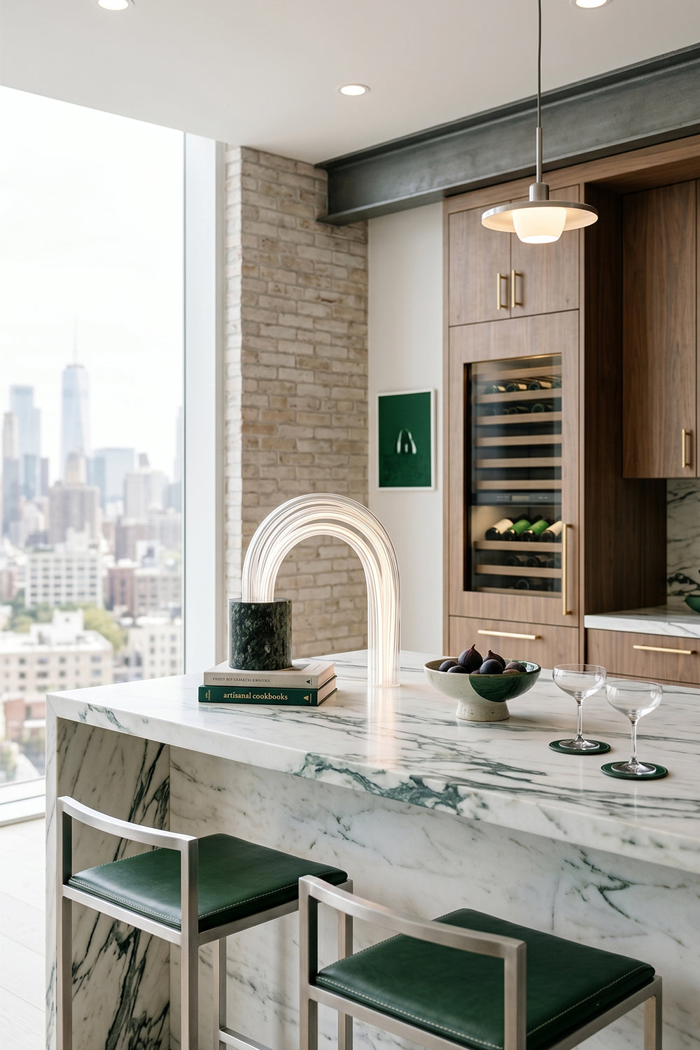 Modern kitchen featuring the Aurelius Ribbed Marble Table Lamp with elegant bar stools and city view.