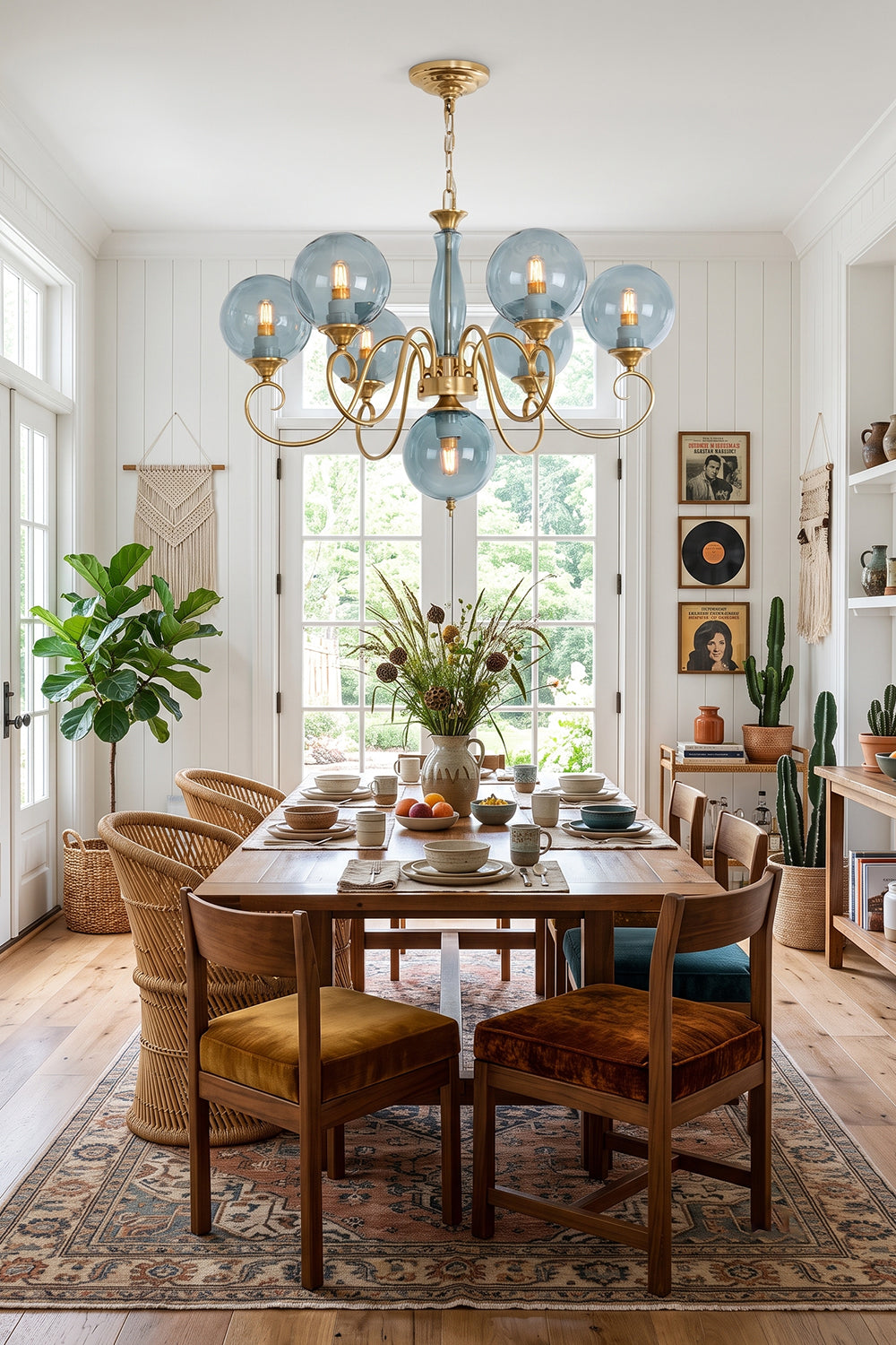 Aveline Globe Cluster Chandelier | Colored Glass and Brass | Blue glass shade version hanging above a wooden dining table | Samu Lamp