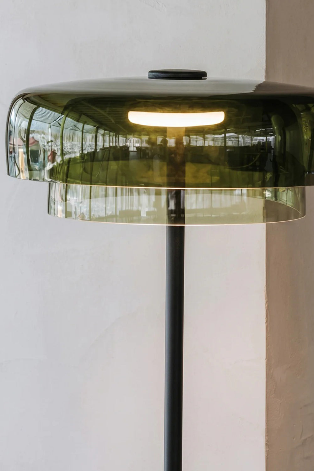 Aven Minimalist Architectural Floor Lamp | Glass, Metal | Close-up focus on the vibrant green glass shade variant showcasing the dual-layer translucent design and internal LED light tube | Detail shot | Samu Lamp